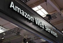 Sign displaying Amazon Web Services at a trade show