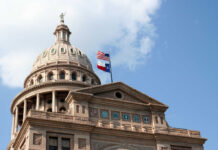 Texas State Capitol dome with American Texas flags