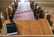 Bible and microphone on a church pulpit