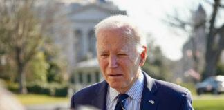 man in tie, outside white house