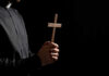 priest with cross