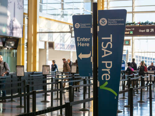 Signage indicating TSA PreCheck entrance at an airport