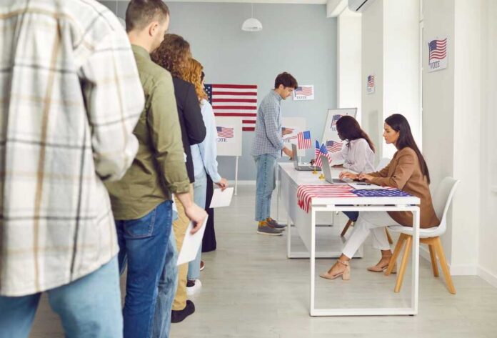 People waiting in line at a polling station to cast their votes