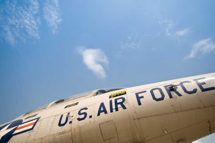Close-up view of a U.S. Air Force aircraft against a blue sky