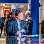 Carlson’s Airport Claim: Media Sensation or Routine Check? man in blue suit