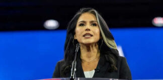 Person speaking at a podium during an event