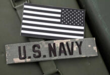 US Navy patch and black and white flag