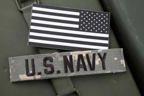 US Navy patch and black and white flag