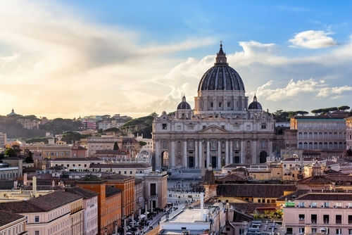 St Peters Basilica with surrounding cityscape at sunset