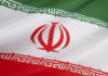 Iranian flag with green, white, red stripes.