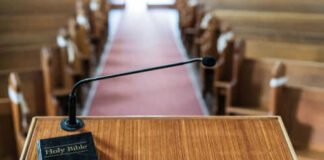 Bible and microphone on a church pulpit