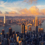 Aerial view of Hong Kong skyline during sunset with clouds