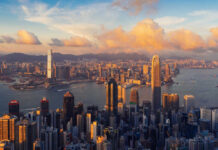 Aerial view of Hong Kong skyline during sunset with clouds