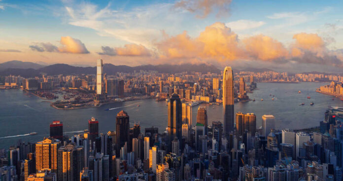 Aerial view of Hong Kong skyline during sunset with clouds