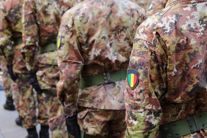 Soldiers in camouflage uniforms standing in formation