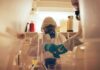 Scientists in protective gear conducting an experiment in a laboratory
