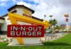 In-N-Out’s Tradition Over Tech: A Rare Industry Stand In-N-Out Burger restaurant sign with a bright yellow arrow