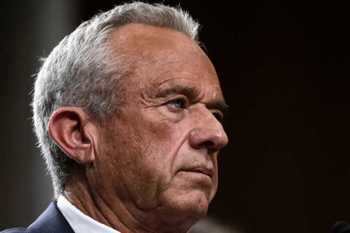 Close-up portrait of a serious-looking man with gray hair