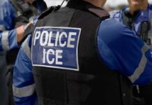 DMV Mayhem Unleashed: Public Tip Leads to ICE Bust Close-up of a police officer's vest with 'POLICE ICE' label