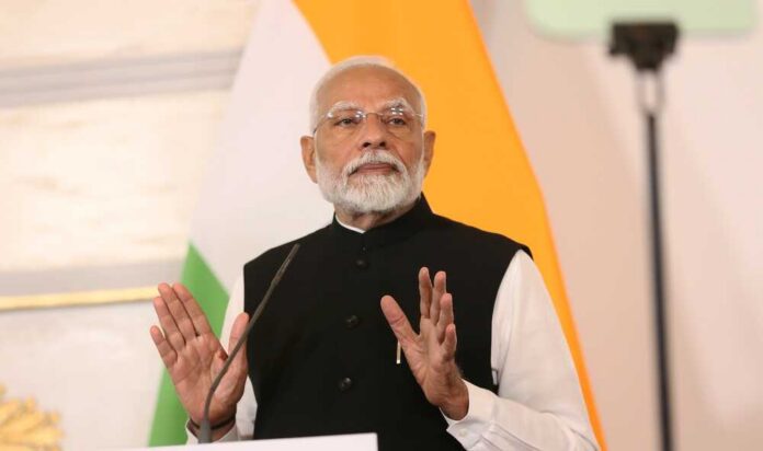 A political leader delivering a speech with hand gestures