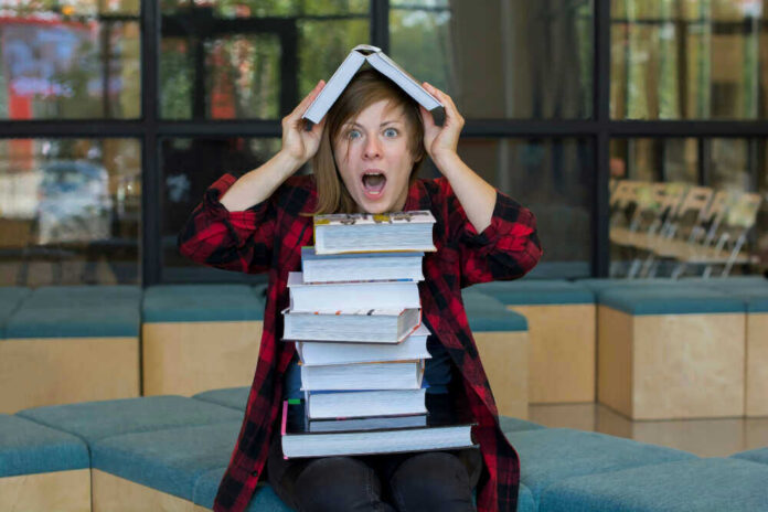 conservative-core-1jpg Person balancing books on head, looking surprised.