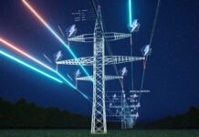 High-voltage transmission tower at night with glowing data overlays