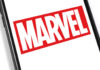 Close-up of the Marvel logo displayed on a smartphone screen