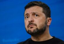 MISSILE Shortage Panic: Zelensky’s Bold Appeal Person with short hair next to blurred yellow flag