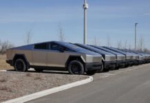 Row of Tesla Cybertrucks parked in a lot