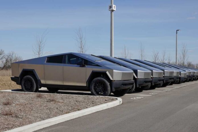 Row of Tesla Cybertrucks parked in a lot