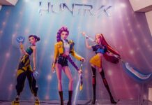 Three stylized female warriors on a display wall