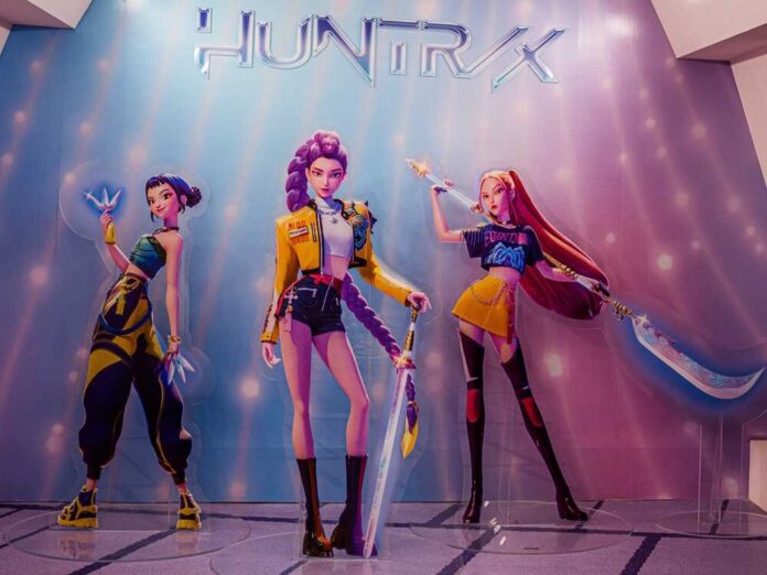 Three stylized female warriors on a display wall