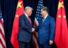 STUNNING Reversal: Xi Controls the Entire Summit Two political leaders shaking hands in front of national flags