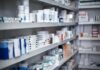 TrumpRx Slashes Prices—Why The Outrage? Shelves filled with various medication boxes and containers in a pharmacy