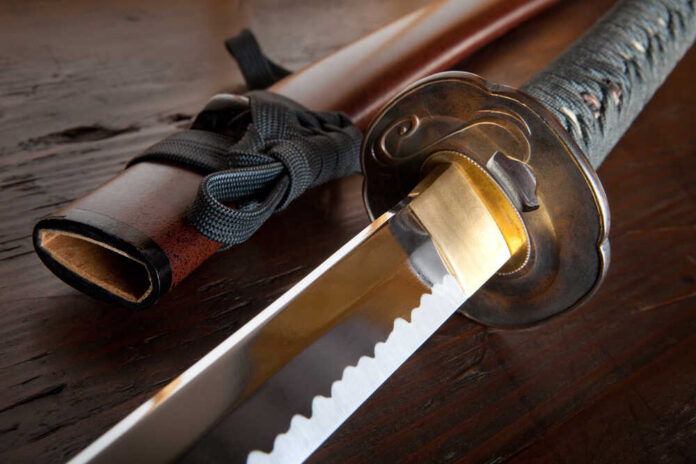 Real,Japanese,Samurai,Sword,And,Sheath,On,Wooden,Board