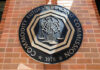 Emblem of the Commodity Futures Trading Commission mounted on a brick wall