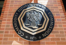 Emblem of the Commodity Futures Trading Commission mounted on a brick wall