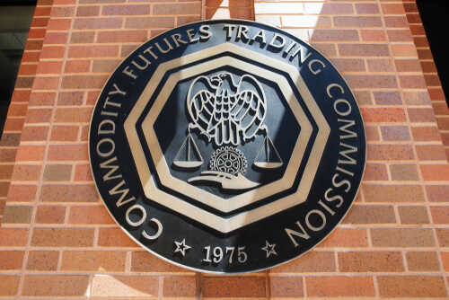 Emblem of the Commodity Futures Trading Commission mounted on a brick wall