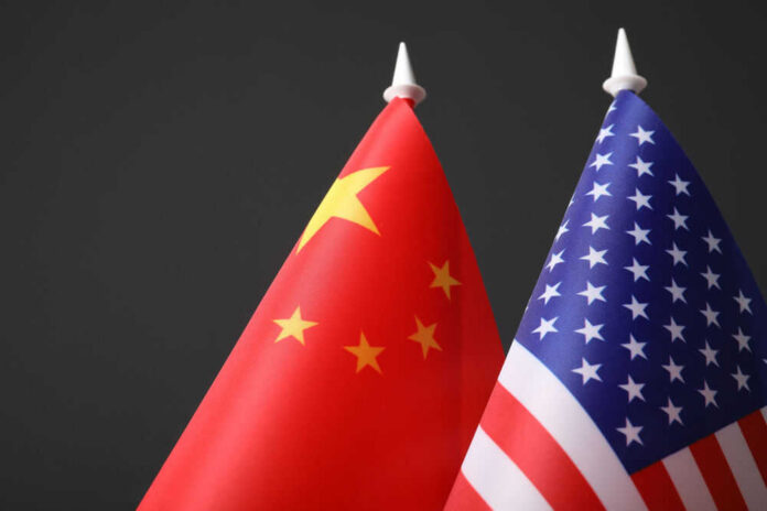 Chinese and American flags side by side.