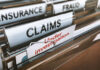 Massachusetts Welfare Heist Unmasked File folders labeled insurance, fraud, claims, investigation.