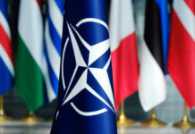 ISIS Raid Bloodies Turkey Before NATO NATO flag in front of various national flags