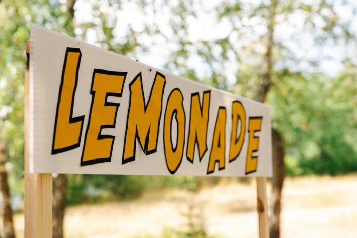 An,Empty,Lemonade,Stand,Ready,For,Children,To,Start,Selling Police officers standing by patrol car and barricade tape