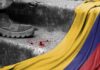 Cartel Grip Tested in Colombia Runoff A military boot on concrete steps with blood stains and a Colombian flag draped nearby