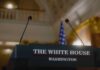 Podium with microphones at the White House for a press conference