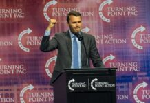 Bold Bid to Kill Death Penalty Fizzles Speaker at podium raising a fist during a conference