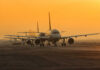 Runway Mix-Up Triggers Logan Panic Airplanes lined up on a runway during sunset