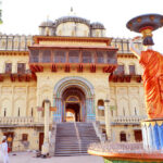 Law-And-Order Showdown Hits Ram Temple Hands holding handcuffs in a black and white image
