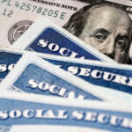 Massive Obamacare Hole Exposes Taxpayer Risk Social Security cards with one hundred dollar bill
