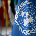 UN Tax Grab? Checkout Pain Ahead United Nations flag with other flags in background