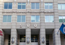 Citizenship Suddenly Feels… Temporary US Immigration and Customs Enforcement building entrance flags